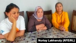 Gulfia Qazybek (left), Khalida Aqytkhan (center), and Gauhar Qurmanalieva were forced from a bus in Almaty on September 12. 