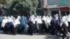 Schoolgirls rally against the closing of their schools in Paktia on September 10.