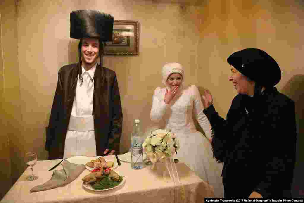Second Place: &quot;First Time&quot; by Agnieszka Traczewska. Mea Shearim, Jerusalem, Israel.&nbsp; &quot;Mea Shearim, Ultra-Orthodox district of Jerusalem. Newly married, Aaron and Rivkeh after the wedding ceremony are to stay together for the very first time, alone. Their marriage was arranged by families. 18 years old candidates confirmed the choice in result of the one meeting only. Since then until the wedding day they were prohibited to meet or even talk.&quot; &nbsp;