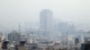 A general view shows smog obscures buildings in Tehran, December 5, 2018