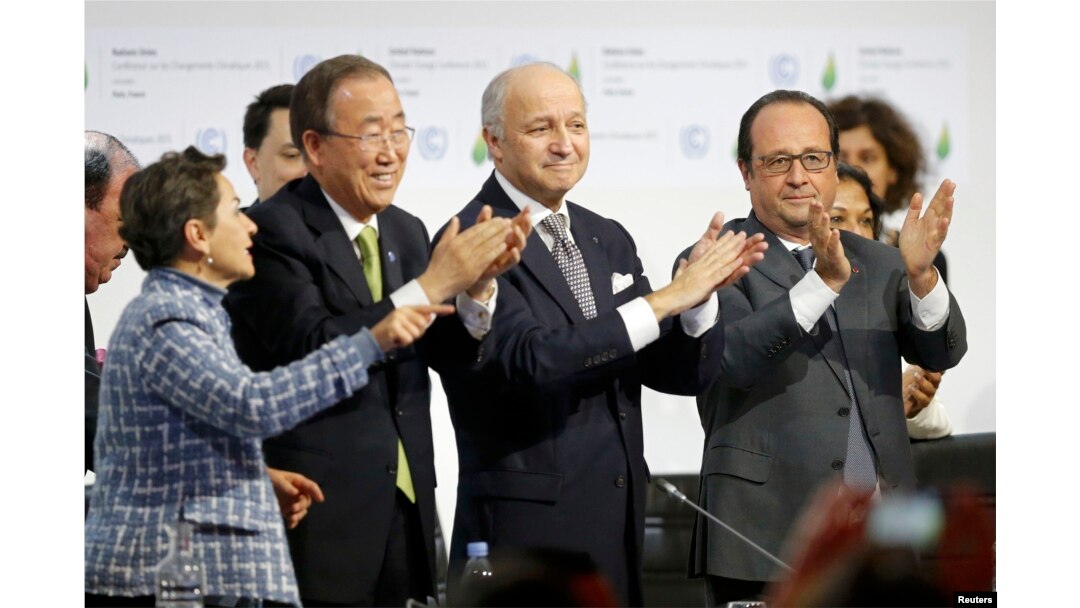 (Left to right:) Christiana Figueres, executive secretary of the UN Framework Convention on Climate Change, United Nations Secretary-General Ban Ki-moon, French Foreign Affairs Minister Laurent Fabius, and French President Francois Hollande applaud during the final plenary session at the World Climate Change Conference 2015, which approved a new environmental agreement in Paris on December 12.