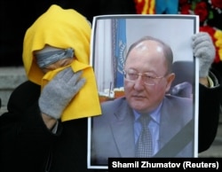 A portrait of Altynbek Sarsenbaiuly, a prospective Kazakh presidential candidate, at his funeral in Almaty in February 2006