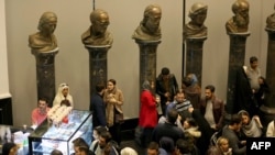 Theatre-goers gather at the Espinas Hotel in the Iranian capital Tehran, before watching the musical production Les Miserables(Photo by ATTA KENARE / AFP)