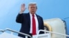 U.S. President Donald Trump boards Air Force One from Joint Base Andrews in Maryland as he departs for Alaska to meet with Russian President Vladimir Putin.