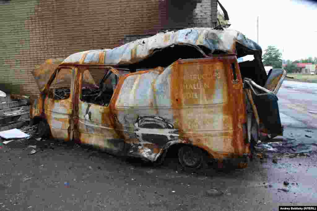 A minivan destroyed by fire. 