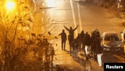 Iranian demonstrators gather in a street during an antiestablishment protest in Tehran on January 8.