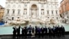 G20 leaders toss a coin into Rome's iconic Trevi Fountain on the sidelines of the G20 summit in Rome on October 31. 