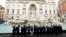 G20 leaders toss a coin into Rome's iconic Trevi Fountain on the sidelines of the G20 summit in Rome on October 31. 