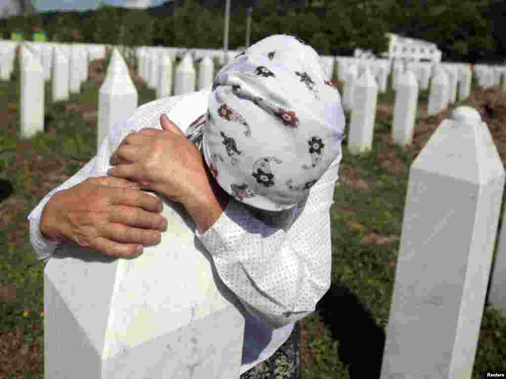 Adila Suljakovic cries at the grave of her son in the Memorial Center in Potocari, near Srebrenica. Tens of thousands of family members, foreign dignitaries, and guests are expected to attend a ceremony in Srebrenica on July 11 marking the 16th anniversary of the massacre, in which Bosnian Serb forces commanded by Ratko Mladic killed up to 8,000 Muslim men and boys.Photo by Dado Ruvic for Reuters