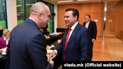 Bulgarian President Rumen Radev (left) and Macedonian Prime Minister Zoran Zaev meet at the summit in Brdo, Slovenia, on October 6.