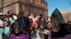 Iranian Armenian Christians gather at the Qareh Kelisa (Black Church) in Dasht-E-Chalran, 373 miles (600 kilometers) northwest of the Iranian capital, Tehran, on Saturday, July 29, 2000. Archbishop Nurvan Zakarian from France, right, Jasliq Aram First, se