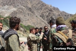Fighters from the National Resistance Front are seen at an unknown location in Afghanistan.