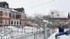 A photo made available by the Russian Investigative Committee shows police near the building of the Orthodox high school after an 18-year-old graduate detonated an explosive device on December 13.