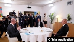 European Council President Charles Michel (left), Armenian Prime Minister Nikol Pashinian (center), and Azerbaijani President Ilham Aliyev hold talks in Brussels on December 14. 