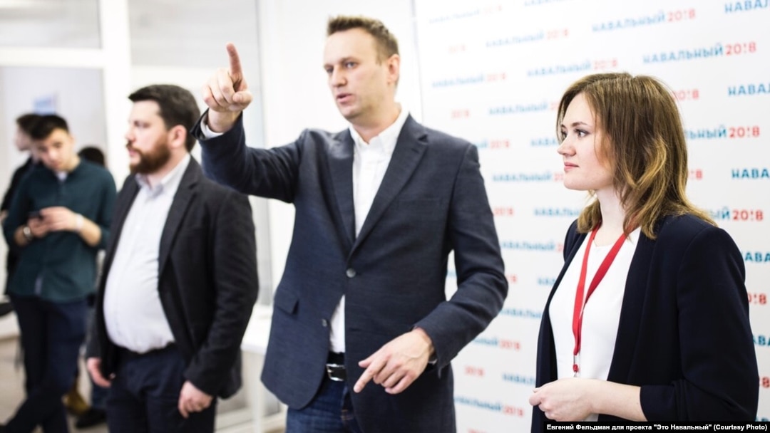 Lilia Chanysheva (right) stands next to Aleksei Navalny (center) at an event in Ufa in an undated photo.