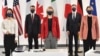 German Foreign Minister Annalena Baerbock (left), Italian Foreign Minister Luigi Di Maio (second from left), British Foreign Secretary Liz Truss (center), U.S. Secretary of State Antony Blinken (second from right) and Canadian Foreign Minister Melanie Joly pose for a group photograph during the G7 summit in Liverpool on December 12. 