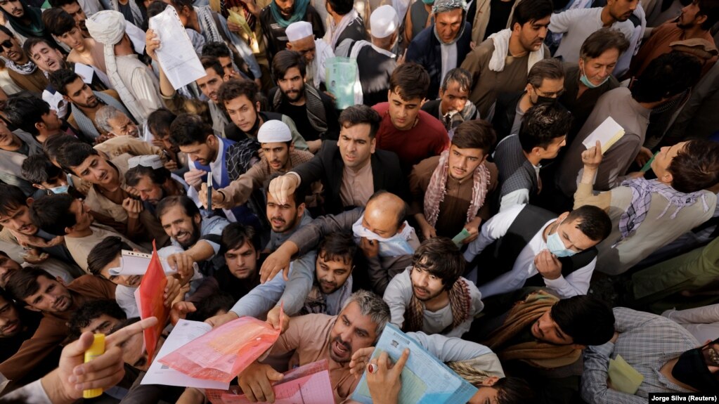 kabul Afghans gather outside the passport office in Kabul after Taliban officials announced they will start issuing passports again in October.
