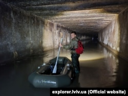 Ryshtun with an inflatable boat he has used to explore some parts of the Poltva, which ranges from around knee to chest deep.