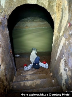 An underground stairway leading to the Poltva River.