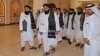 Members of a Taliban delegation arrive for a meeting with foreign diplomats in Qatar's capital Doha, in October 2021. 