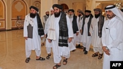 Members of a Taliban delegation arrive for a meeting with foreign diplomats in Qatar's capital Doha, in October 2021. 