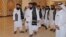 Members of a Taliban delegation arrive for a meeting with foreign diplomats in Qatar's capital Doha, in October 2021. 