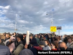 Serbian protesters rally on a bridge in Novi Sad against amendments to the referendum and expropriation law on November 27.