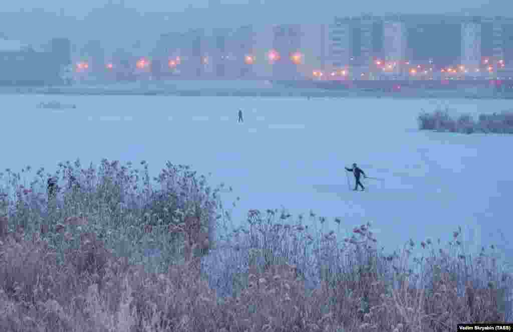 A man skis across frozen Lake Saisary in Yakutsk, the capital of the Sakha Republic (Yakutia) in the Russian Far East.