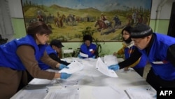 Members of a local election commission count votes as part of Kyrgyzstan's parliamentary elections in the village of Gornaya Mayevka, outside Bishkek, on November 28. 