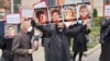 Families of the victims of the downing of the Ukrainian plane demonstrate in front of the military court in Tehran in November 2021.