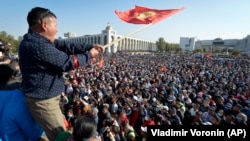 People protest during a rally against the results of a parliamentary vote in Bishkek on October 5, 2020.