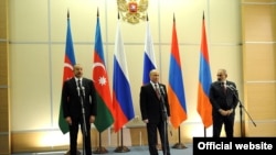 (Left to right) Azerbaijani President Ilham Aliyev, Russian President Vladimir Putin and Armenian Prime Minister Nikol Pashinian attend a press briefing after their trilateral talks in Sochi, Russia, November 26, 2021.