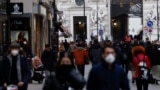 Pedestrians walk along a shopping street in Vienna, Austria, November 17, 2021. 