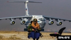 A Taliban fighter on duty at the international airport in Kabul. (file photo)