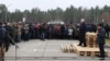 Belarusian strongman Alyaksandr Lukashenka speaks to migrants near a warehouse shelter along the border with Poland on November 26, 2021. 