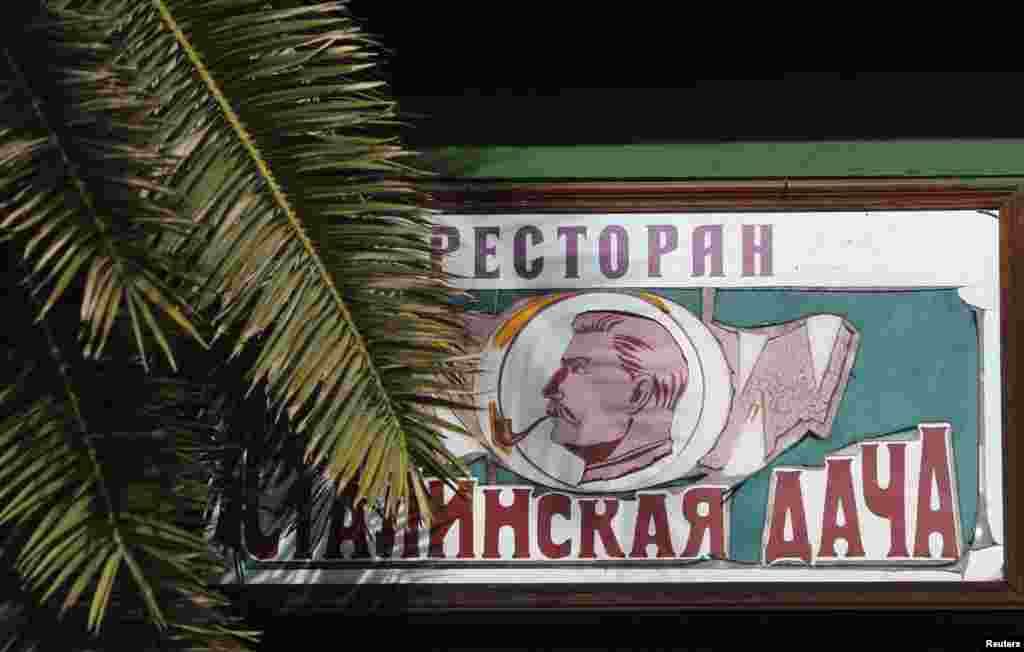 A sign advertising the &quot;Stalin&#39;s Dacha&quot; restaurant