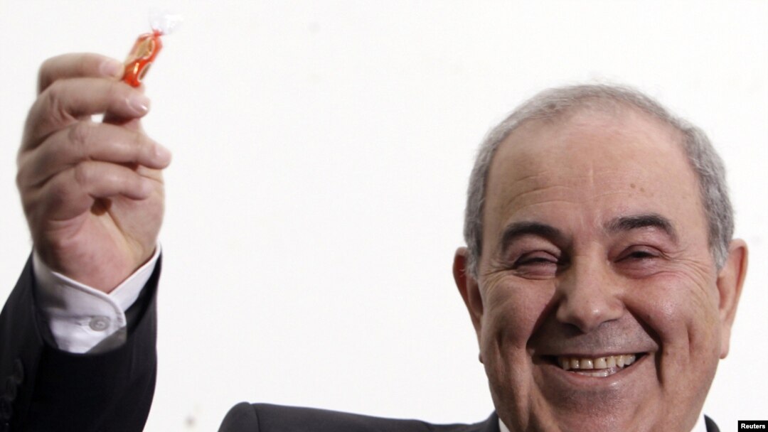 Former Prime MInister Iyad Allawi smiles while speaking to the media in Baghdad on March 27.