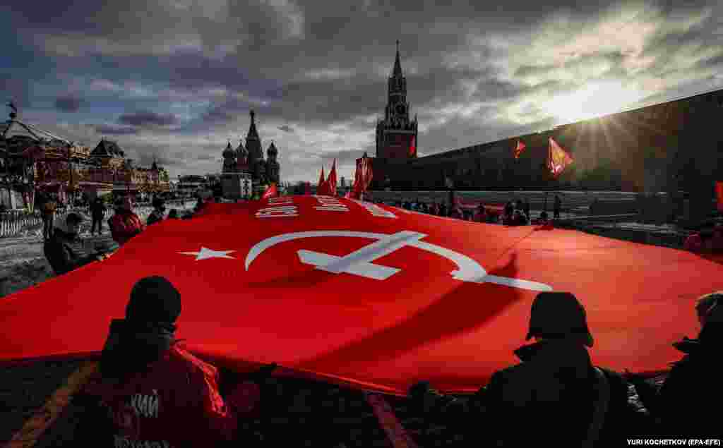 Communist Party members and supporters hold a huge replica of the Victory banner on Red Square in Moscow on December 4 to mark the 80th anniversary of the decisive Soviet counteroffensive near Moscow during World War II.