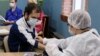 A Russian man receives a dose of vaccine against COVID-19 in St. Petersburg. 