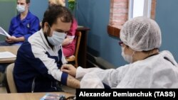 A Russian man receives a dose of vaccine against COVID-19 in St. Petersburg. 