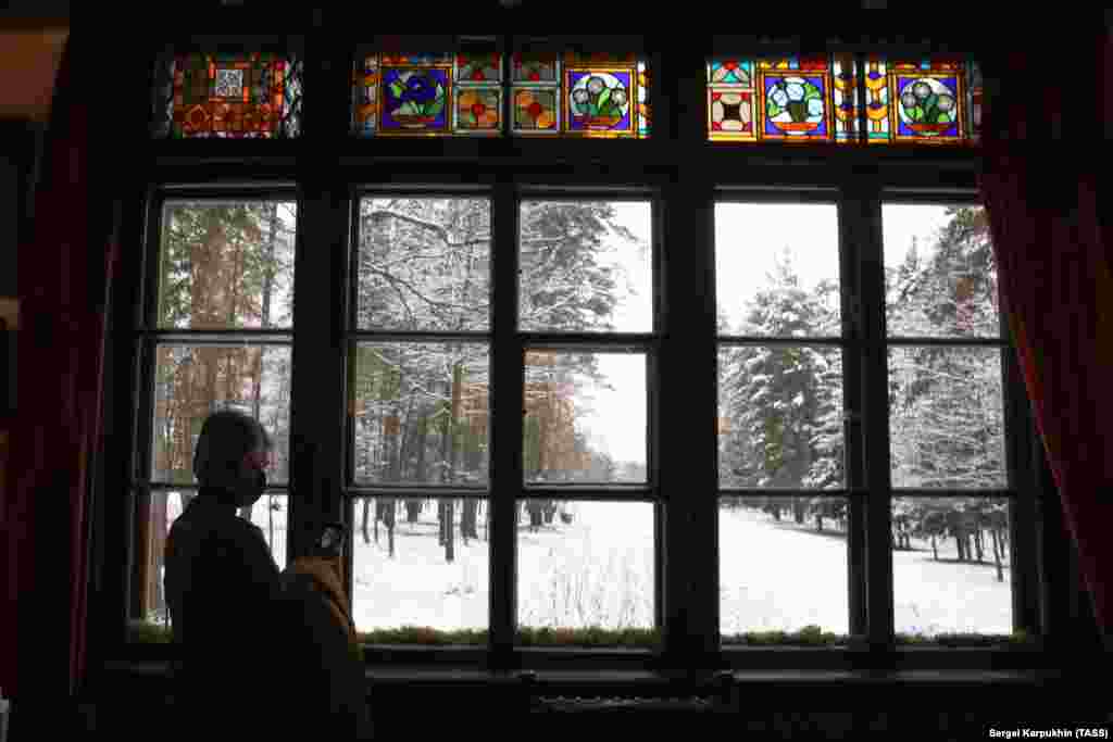 A visitor looks out of the Vasily Polenov Museum in the village of Bekhovo, Russia, which has been named one of the &quot;best tourism villages,&quot; after 170 villages from 75 countries took part in the contest.