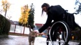 Biljana Nedić was born with inborn defect, she cannot walk. Despite that, she leads an active life.
