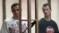 Ukrainian film director Oleh Sentsov (left) and co-defendant Oleksandr Kolchenko appear in court on July 21.