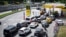 People wait in line to refuel their cars at a gas station in Moscow on June 30. Ukraine's drone campaign targeting Russian oil refineries is rippling across the country, from the capital to regions as far away as Irkutsk and Khabarovsk. 