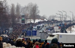 People walk toward the Borisovskoye cemetery during Aleksei Navalny's funeral in Moscow on March 1.