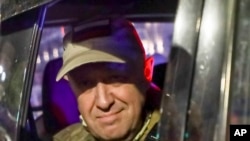 Yevgeny Prigozhin, head of the Wagner Group military group, looks out from a military vehicle on a street in Rostov-on-Don, Russia, on June 24.