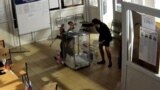 Russia -CCTV footage shows ballot box stuffing in St. Petersburg during Russian presidential election - screen grab