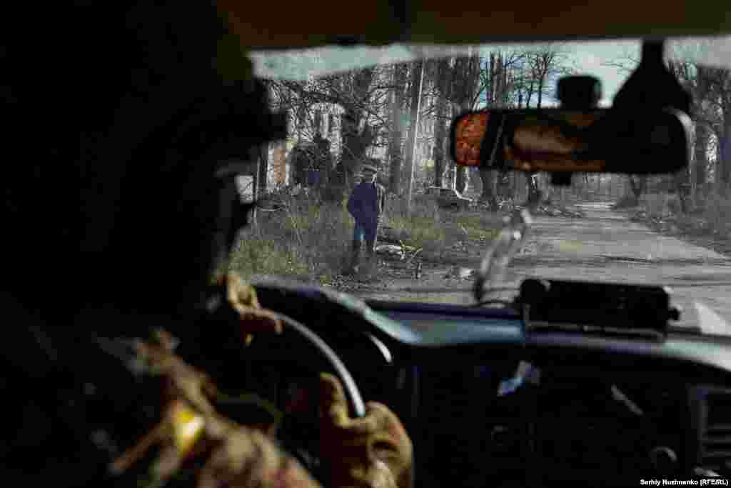 A local resident stands near damaged homes. Avdiyivka had a prewar population of around 30,000 people, but it&#39;s estimated that only 1,600 people still remain in the devastated city, where there is no electricity or running water.