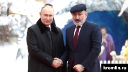 Russia - President Vladimir Putin greets Armenian Prime Minister Nikol Pashinian during a CIS summit in St. Petersburg, December 26, 2023.