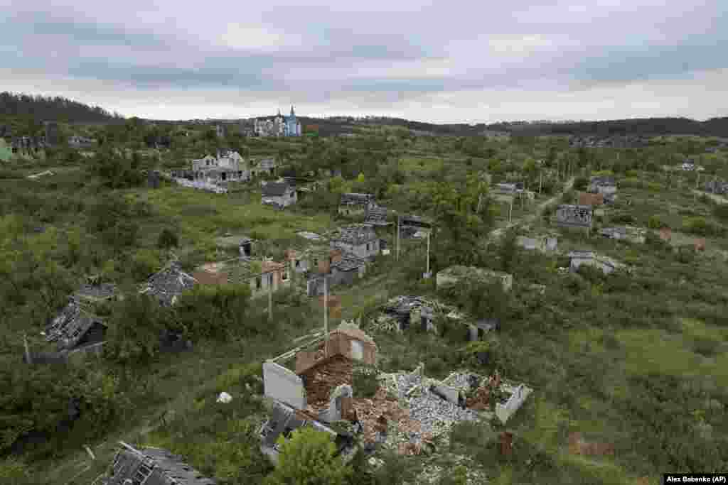 Houses destroyed by Russian shelling are seen in the Ukrainian village of Bohorodychne.